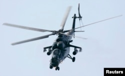 FILE - A Russian military MI-35M helicopter performs during an air show in Zhukovsky, outside Moscow, Aug. 23, 2007. Russia has sold the combat helicopters to Pakistan.