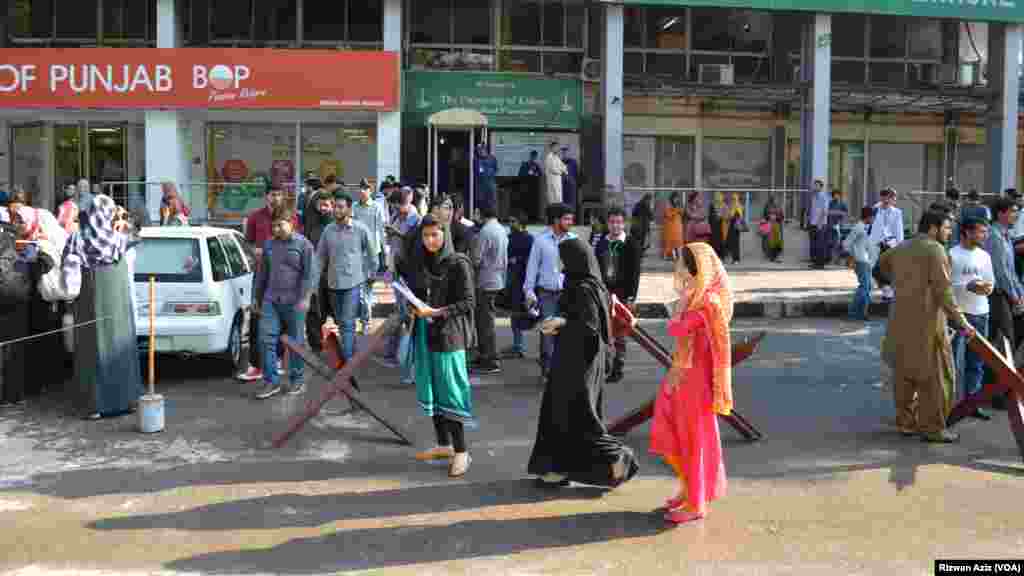 People gather outside after a strong earthquake shook northern Afghanistan and Pakistan. 