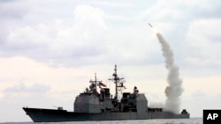 FILE - A Tomahawk Land Attack Missile (TLAM) launches from the guided missile cruiser USS Cape St. George (CG 71) in operation in the Mediterranean Sea on March 23, 2003.