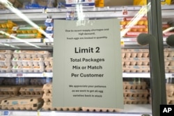 A sign limiting the sale of egg packages for customers is displayed at grocery store, Feb. 7, 2025, in Dallas, Texas.