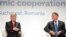 Croatian President Kolinda Grabar-Kitarovic (L) talks to Romanian counterpart Klaus Iohannis at the opening of the Three Seas Initiative Business Forum in Bucharest, Romania, Sept. 17, 2018.