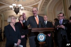 Senate Minority Leader Chuck Schumer, D-N.Y., Sen. Patty Murray, D-Wash., Sen. Debbie Stabenow, D-Mich., and Sen. Dick Durbin, D-Ill., the assistant Democratic leader, talks to reporters about the possibility of a partial government shutdown, at the Capitol, Dec. 18, 2018.