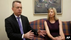 Pastor Andrew Brunson, left, gestures as his wife, Norine, listens during an interview at the headquarters of Christian Broadcasting Network in Virginia Beach, Va., Oct. 19, 2018. Brunson was recently released from prison in Turkey. 