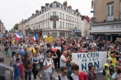 Demonstrators march during a far-right rally against the health pass, Aug. 21, 2021 in Lille, northern France.