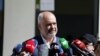 FILE - Albania's Prime Minister Edi Rama speaks to the media near Tirana, Albania, June 30, 2019. An open letter from leading press freedom advocates Monday warned Rama of "a turn to the worst for Albania's press freedom climate." 