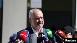 FILE - Albania's Prime Minister Edi Rama speaks to the media near Tirana, Albania, June 30, 2019. An open letter from leading press freedom advocates Monday warned Rama of "a turn to the worst for Albania's press freedom climate." 