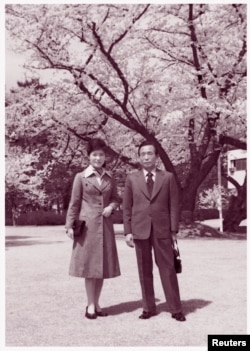 FILE - In this undated handout photo received Dec. 19, 2012, Park Geun-hye poses with her father and then-President Park Chung-hee.