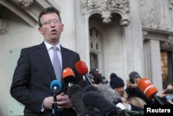 Britain's Attorney General, Jeremy Wright, speaks outside the Supreme Court, in Parliament Square, London, Jan. 24, 2017.