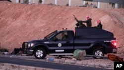 Jordanian security forces leave Swaqa prison, after the executions of Sajida al-Rishawi and Ziad al-Karbouly, two Iraqis linked to al-Qaida, about 50 miles (80 kilometers) south of the Jordan's capital, Amman, Feb. 4, 2015. 