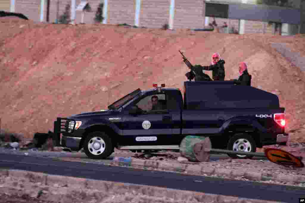 Jordanian security forces leave Swaqa prison, after the executions of Sajida al-Rishawi and Ziad al-Karbouly, two Iraqis linked to al-Qaida, about 50 miles (80 kilometers) south of the capital, Amman, Feb. 4, 2015. Jordan executed two prisoners before dawn, just hours after an online video purported to show Islamic State group militants burning a captured Jordanian pilot to death in a cage.