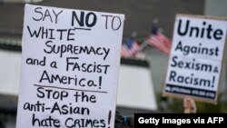 Activists demonstrate against violence towards women and Asians following the Georgia spa shootings on March 18, 2021, in Atlanta, Georgia.