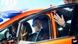 President Obama sits in the 2017 Chevrolet Bolt EV, an all-electric vehicle with an estimated range of 200 miles on a single charge, as he tours the North American International Auto Show in Detroit, Jan. 20, 2016.