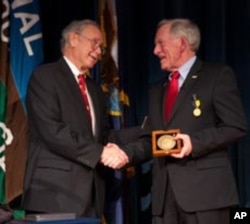 Don Walsh is given the Hubbard Medal by National Geographic.