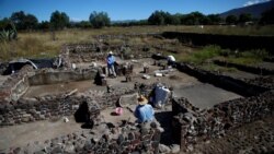 Men work at one of the multi-family apartment compounds at La Ventilla, one of the most extensively excavated neighborhoods in the ancient city of Teotihuacan, November 7, 2019. (REUTERS/Gustavo Graf)