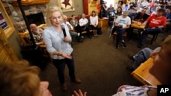 Democratic presidential candidate Sen. Kirsten Gillibrand speaks to local residents at a coffee shop, May 25, 2019, in Mason City, Iowa.