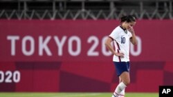United States' Carli Lloyd leaves the field after being defeated 1-0 by Canada during a women's semifinal soccer match at the 2020 Summer Olympics, Aug. 2, 2021, in Kashima, Japan.
