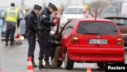French police conduct a control at the French-German border in Strasbourg, France, to check vehicles and verify the identity of travelers as security increases after last Friday's deadly attacks in Paris, Nov. 20, 2015.