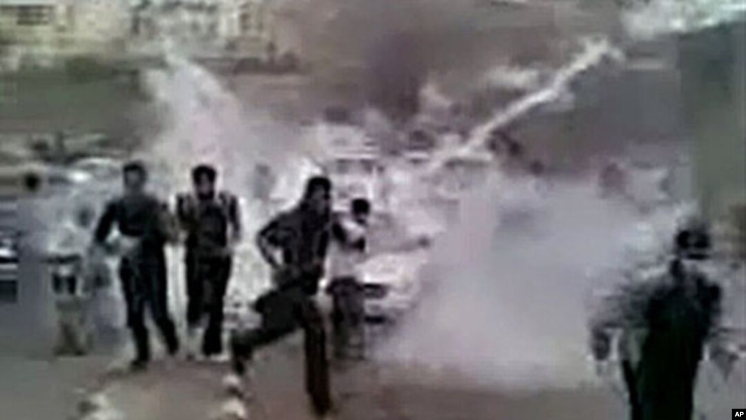 In this image grab obtained by AFPTV from YouTube on March 23, 2011, Syrian protesters run for cover from tear gas during a recent but undated demonstration in the southern town of Daraa. AFP could verify that the pictures were shot in Daraa.