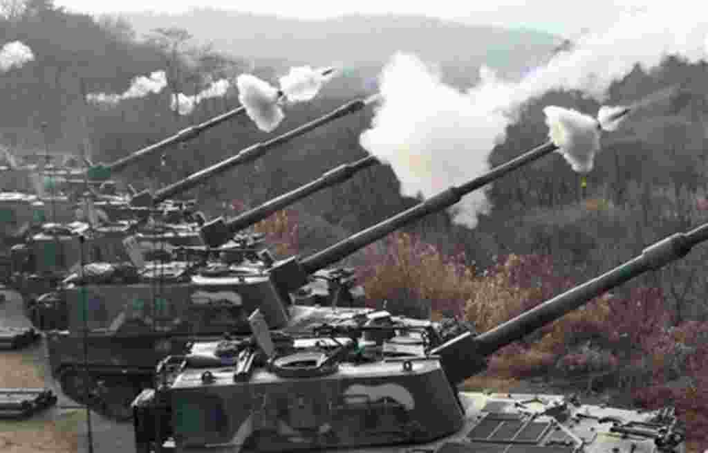 South Korean Army's K-9 self-propelled gun fire live rounds during the largest joint air and ground military exercises on the Seungjin Fire Training Field in mountainous Pocheon, 20 miles (30 kilometers) from the Koreas' heavily fortified border, South Ko