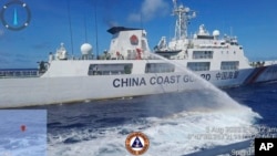 FILE - In this handout photo provided by the Philippine Coast Guard, a Chinese coast guard ship uses water canons on a Philippine coast guard ship near Second Thomas Shoal, South China Sea, during a Philippine re-supply mission on Aug. 5, 2023. 