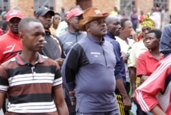 FILE - Burundi's President Pierre Nkurunziza queues at a polling station during elections, under the simmering political violence and the growing threat of the coronavirus, in Ngozi, Burundi, May 20, 2020.