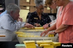 Election workers process ballots for the U.S. midterm election at Cobb County Elections and Registration Center in Marietta, Georgia, U.S., November 8, 2022. (REUTERS/Cheney Orr)