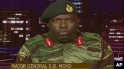 FILE: In this image made from video, Major Gen. S.B. Moyo, Spokesperson for the Zimbabwe Defense Forces addresses to the nation in Harare, Zimbabwe, Nov. 15, 2017. 