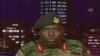 FILE: In this image made from video, Major Gen. S.B. Moyo, Spokesperson for the Zimbabwe Defense Forces addresses to the nation in Harare, Zimbabwe, Nov. 15, 2017. 