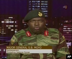 In this image made from video, Major Gen. S.B. Moyo, Spokesperson for the Zimbabwe Defense Forces addresses to the nation in Harare, Zimbabwe, Nov. 15, 2017.
