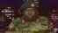 FILE: In this image made from video, Major Gen. S.B. Moyo, Spokesperson for the Zimbabwe Defense Forces addresses to the nation in Harare, Zimbabwe, Nov. 15, 2017. 