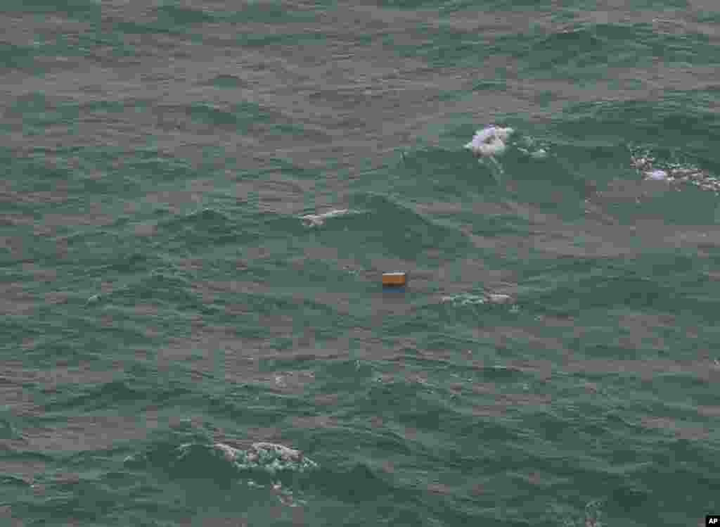 This aerial photo shows piece of objects floating on the waters of Java Sea near Central Kalimantan province, Indonesia, Tuesday, Dec. 30, 2014.