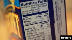 Nutrition facts are seen on a Diamond Food's Pop Secret microwave popcorn box in New York, Nov. 8, 2013.