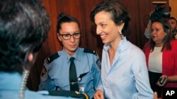 UNESCO'S new elected director-general France's Audrey Azoulay smiles as she arrives to the council hall at the UNESCO headquarters in Paris, Oct. 13, 2017