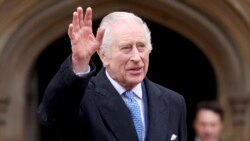 FILE — Britain's King Charles III is pictured waving outside St. George's Chapel, Windsor Castle, England, on March 31, 2024.