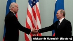 RUSSIA -- Russian Prime Minister Vladimir Putin shakes hands with U.S. Vice President Joe Biden during their meeting in Moscow, March 10, 2011.