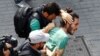 26 Haziran 2016 - İstanbul'da polisin müdahale ettiği Onur Yürüyüşü'nde gözaltına alınan bir aktivist