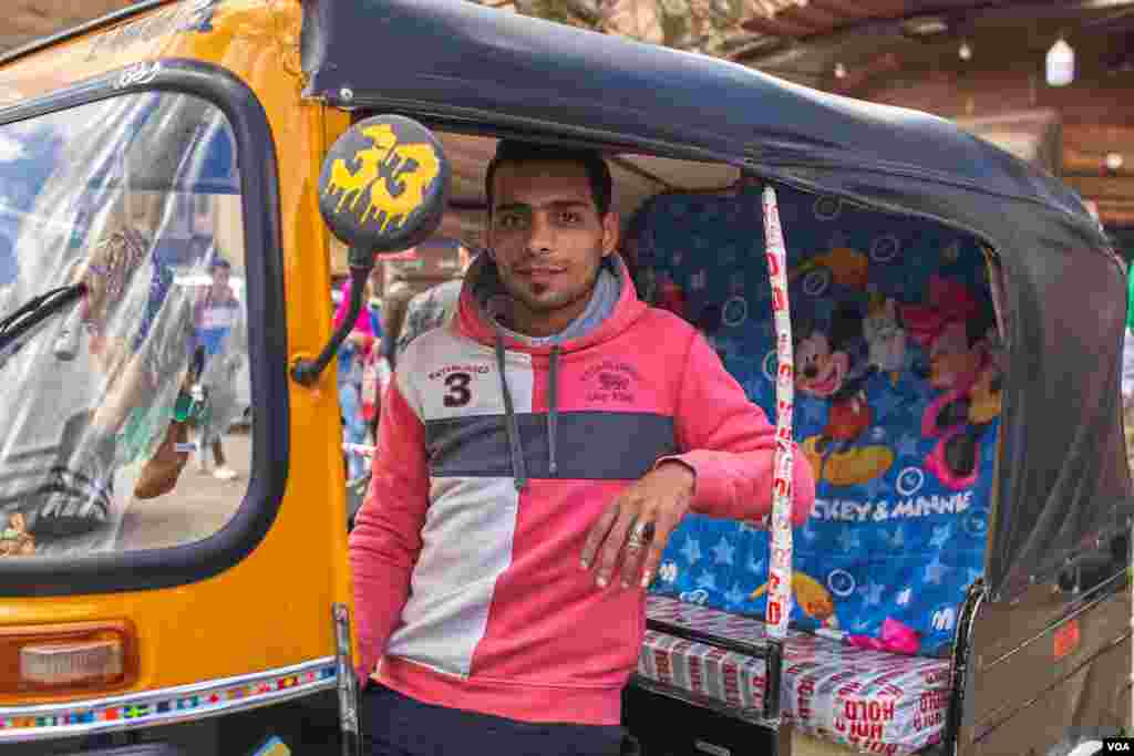 A toktok owner, and driver Mohamed Gafaar says, &quot;It is not the best option for work, it is not a craft to master, but I need money to get married.&quot; (H. Elrasam/VOA) 