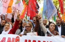 FILE - Turkish Kurds and others rally in support of Kurdish fighters who have gone to defend the Syrian town of Kobane against Islamic State extremists, in the central Turkish city of Ankara, Nov. 1, 2014.