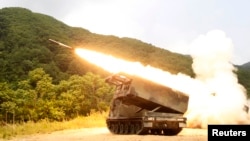 FILE - A rocket is launched from an MLRS during a training exercise involving part of the U.S. 2nd Infantry Division and the South Korean army at Cheorwon, South Korea, June 2012.