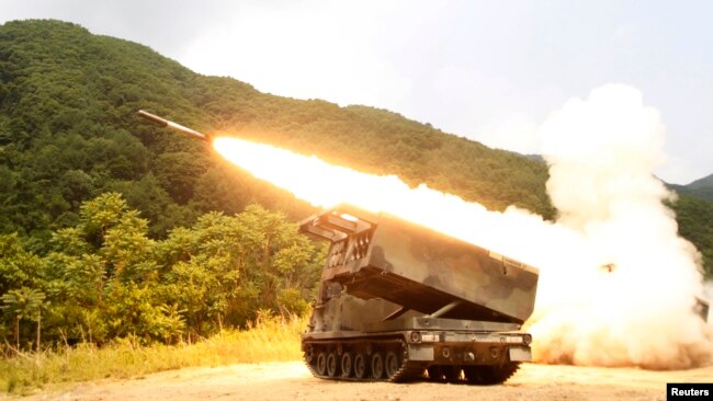 FILE - A rocket is launched from an MLRS during a training exercise involving part of the U.S. 2nd Infantry Division and the South Korean army at Cheorwon, South Korea, June 12, 2012. Ukraine has been pleading for weeks with the U.S. to get American-made MLRS weaponry.