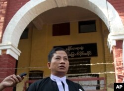 Than Zaw Aung, lawyer of two Reuters journalists Wa Lone and Kyaw Soe Oo, talks to journalists after their trial, Feb. 1, 2018, outside of Yangon, Myanmar.