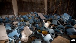 This Feb. 2, 2017, photo shows seats jumbled in a pile inside Maracana stadium in Rio de Janeiro, Brazil. The historic stadium was the site of the opening and closing ceremony.