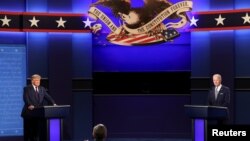 U.S. President Donald Trump and Democratic presidential nominee Joe Biden participate in their first 2020 presidential campaign debate held on the campus of the Cleveland Clinic at Case Western Reserve University in Cleveland, Ohio, U.S., September 29, 20