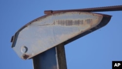 If you wonder why pumpjacks are sometimes called horseheads, stick a couple of ears and paint an eye on each side of this one, and you'll see.