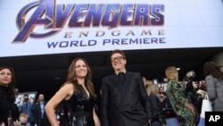 Susan Downey, left, and Robert Downey Jr. arrive at the premiere of "Avengers: Endgame" at the Los Angeles Convention Center, April 22, 2019. 