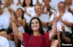 FILE - Peruvian presidential candidate Veronika Mendoza of the Frente Amplio party gestures during an event to introduce her team in Lima, March 28, 2016.