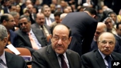 Thủ tướng Iraq Nouri al-Maliki (giữa) dự phiên họp Quốc hội, 1/7/14 