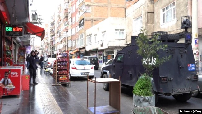 In Baglar, there is a heavy security presence offering protection to AKP activists, allowing them to campaign freely.