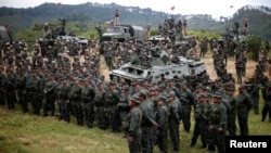 Members of the National Bolivarian Armed Forces attend a news conference of Venezuela's Defense Minister Vladimir Padrino Lopez in Caracas, Venezuela, Aug. 14, 2017. 