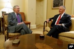 FILE - Senate Majority Leader Mitch McConnell of Kentucky, left, meets with Secretary of State-designate Rex Tillerson, on Capitol Hill, Jan. 4, 2017.